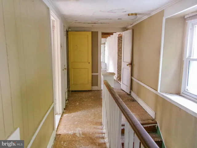 a view of an entryway and livingroom