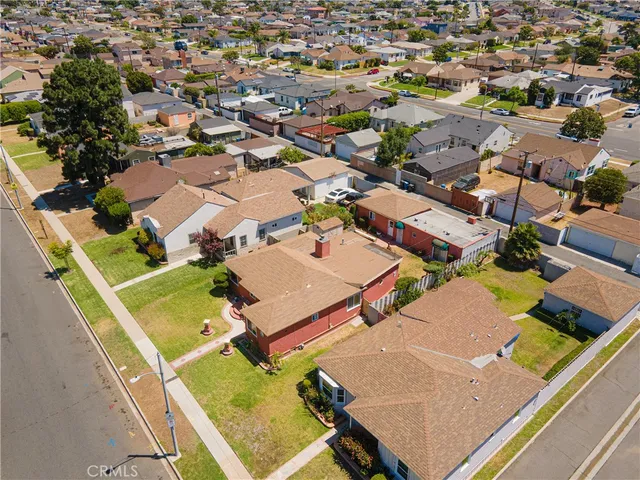 an aerial view of a residential houses with outdoor space