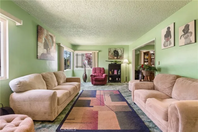 a living room with furniture or couch and a window