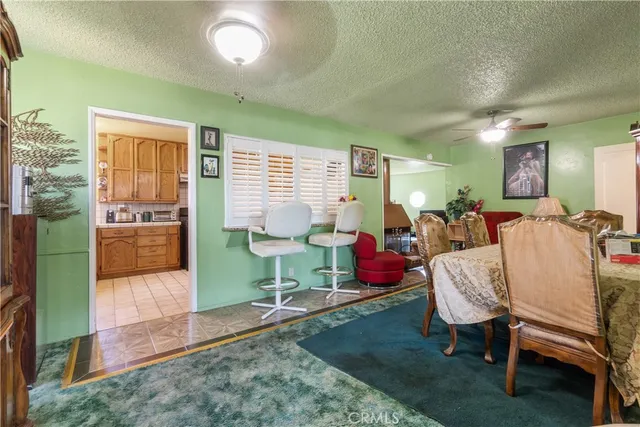 a bed room with furniture and a chair