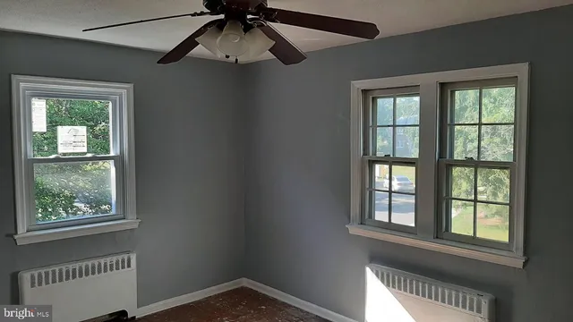 a view of an empty room with a window