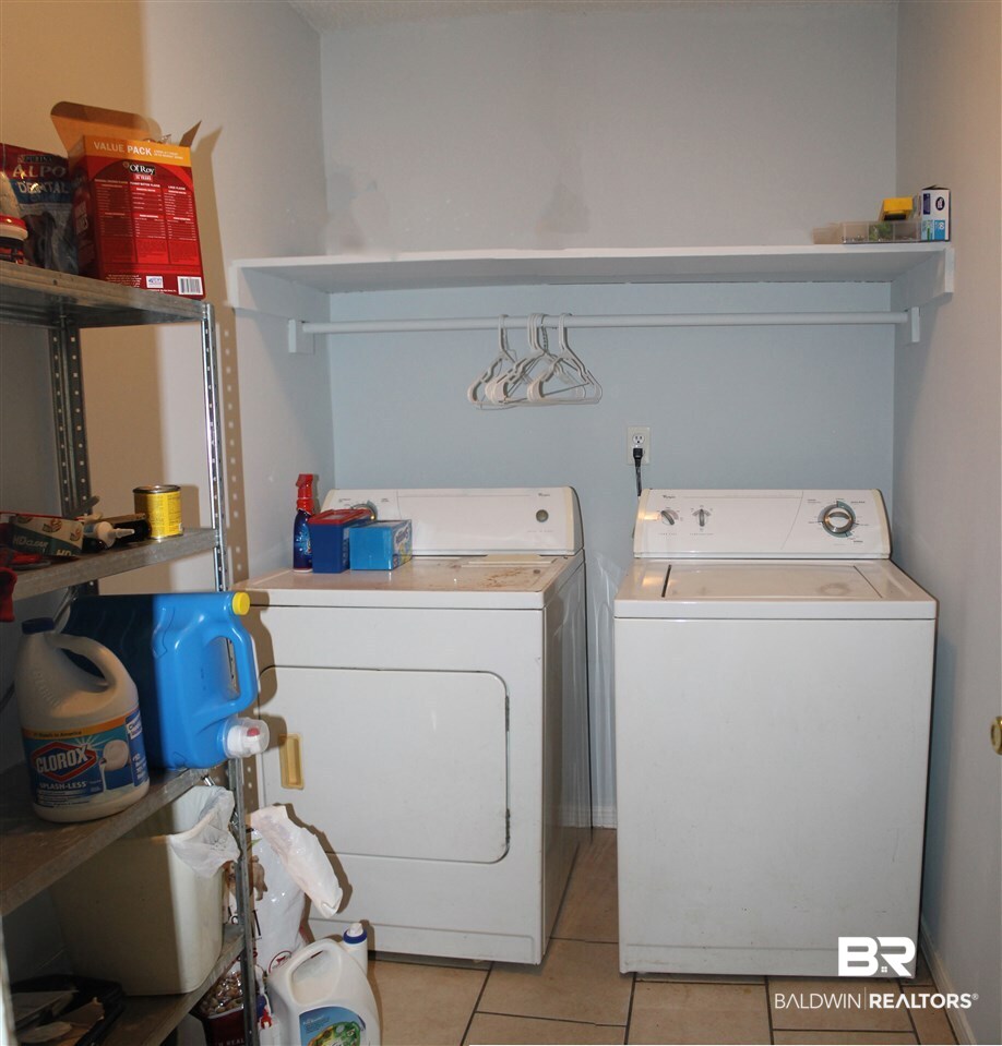 4587 Emerald Drive East Mobile, AL 36619 - Photo 12 of 16 Nice sized laundry room with shelving.