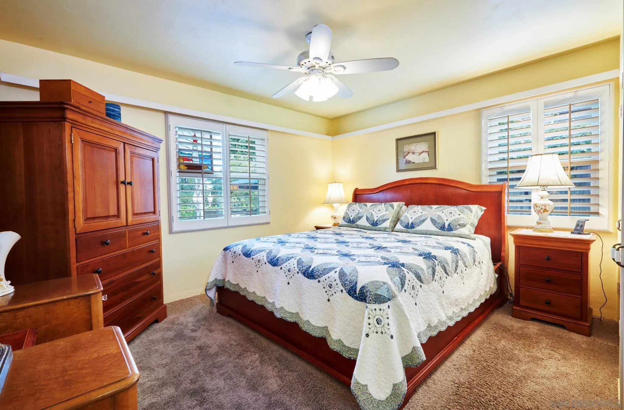 4437 Upland Street La Mesa, CA 91941 - Photo 15 of 24 a bed sitting in a bedroom next to a window