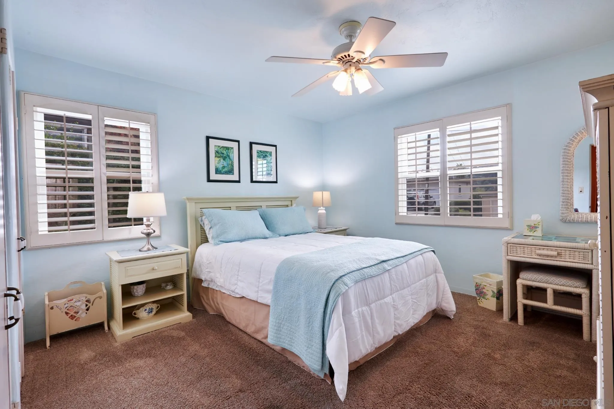 4437 Upland Street La Mesa, CA 91941 - Photo 16 of 24 a bedroom with a bed and a chandelier