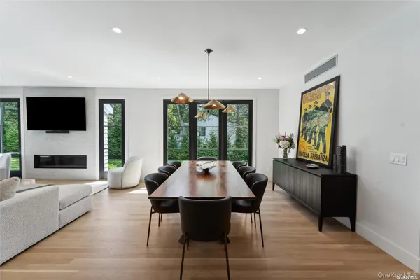 a dining room with furniture window wooden floor