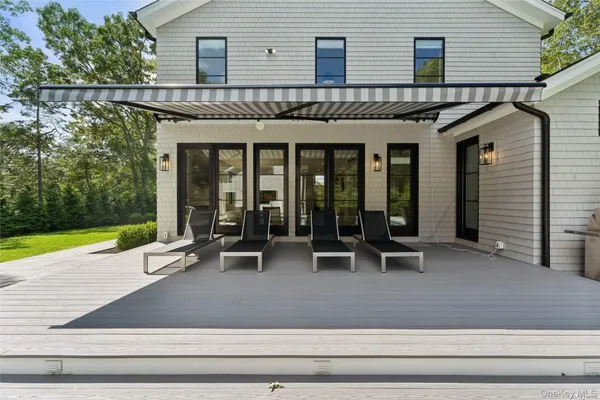 a view of a house with sitting area and garden