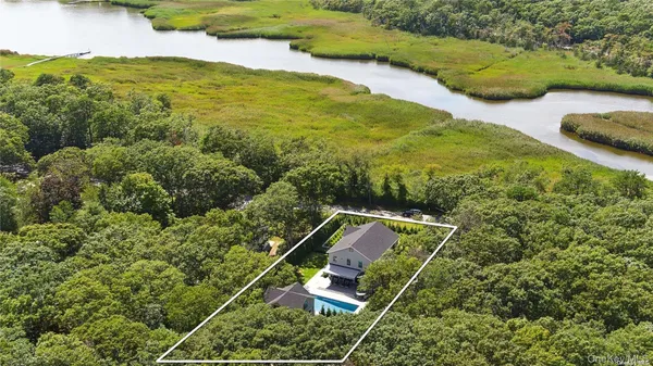 an aerial view of residential houses with outdoor space