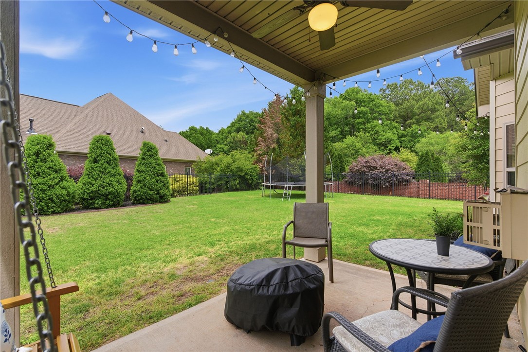 138 Buckland Drive Anderson, SC 29621 - Photo 41 of 49 This inviting patio extends to a lush green yard, ideal for outdoor enjoyment and relaxation.