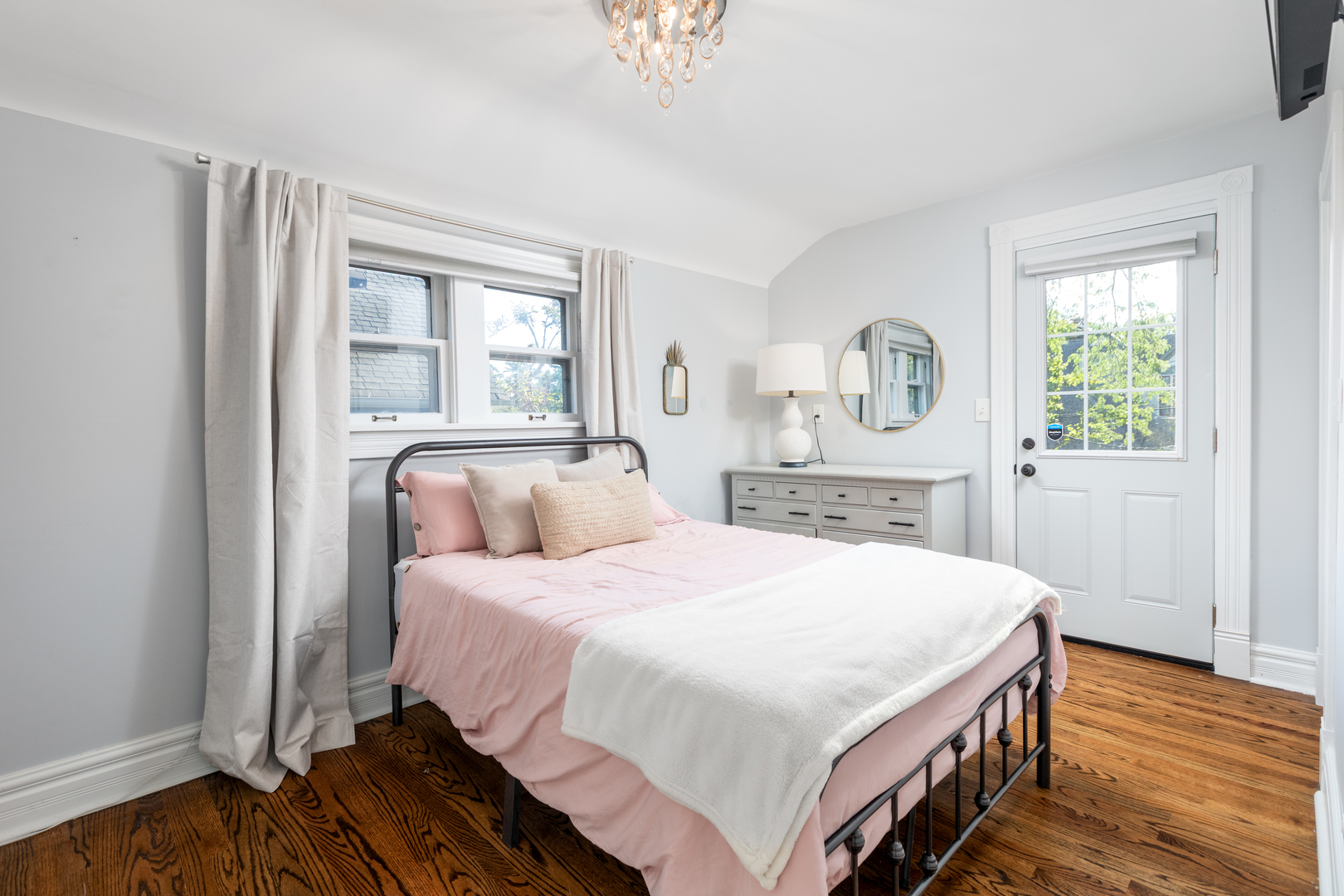 105 South Wright Street Naperville, IL 60540 - Photo 28 of 47 a bedroom with a bed and wooden floor