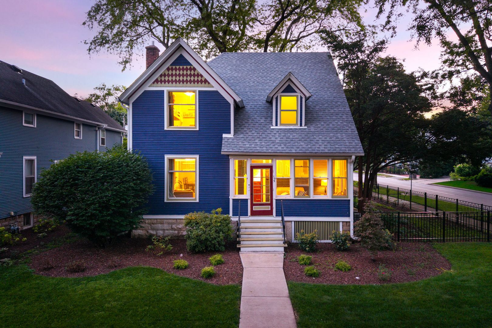 105 South Wright Street Naperville, IL 60540 - Photo 4 of 47 a view of a brick house with a yard plants and a large tree