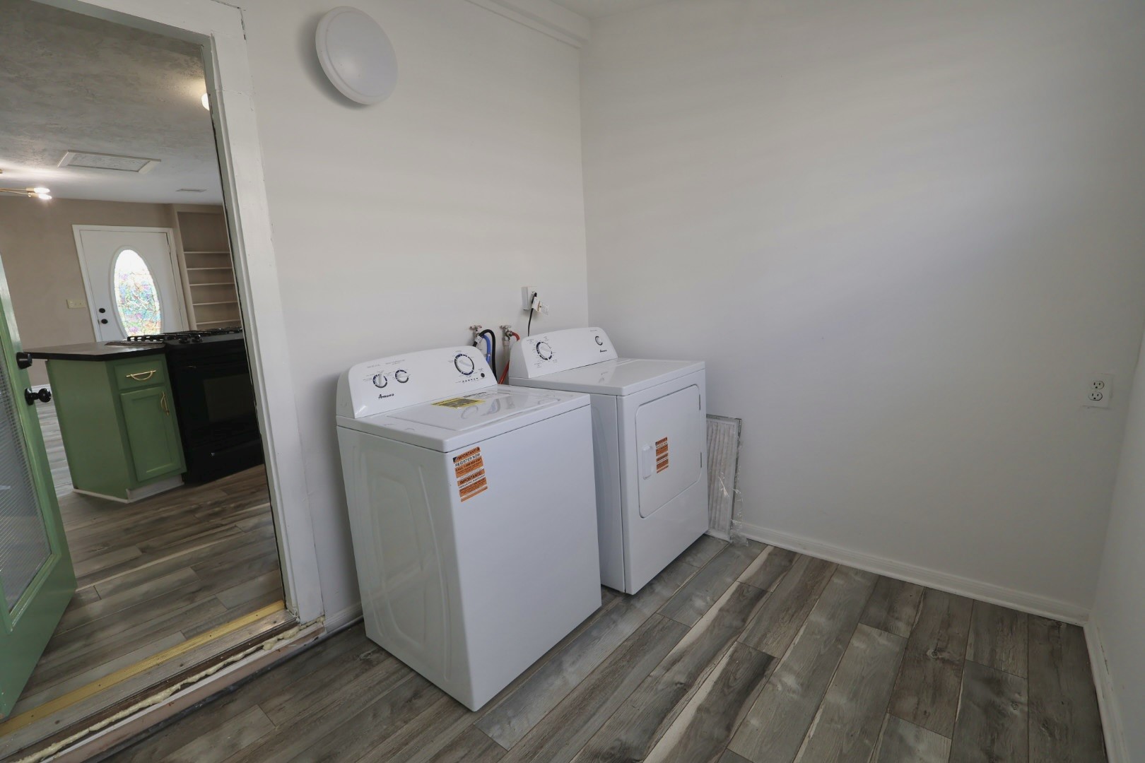 642 5th Street Dickinson, TX 77539 - Photo 15 of 20 Functional utility room with ample space for laundry and storage