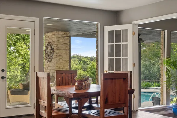 a view of a dining room with furniture and a window