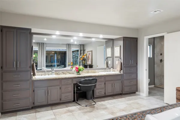a kitchen with sink and cabinets