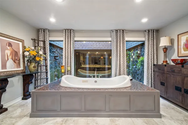 a living room with couch and dining area