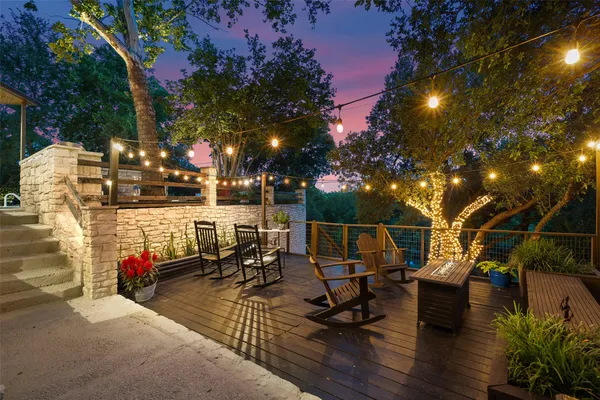 a view of a backyard with sitting area