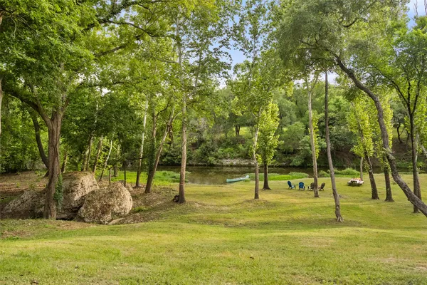a view of swimming pool with a backyard