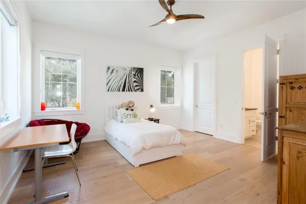 a bedroom with furniture and a gym equipment