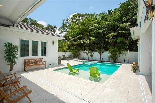 a house view with a sitting space and garden