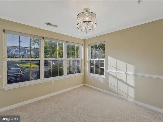 a view of empty room with windows