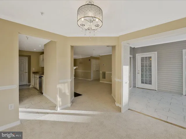 a view of a room with a ceiling fan and bathroom