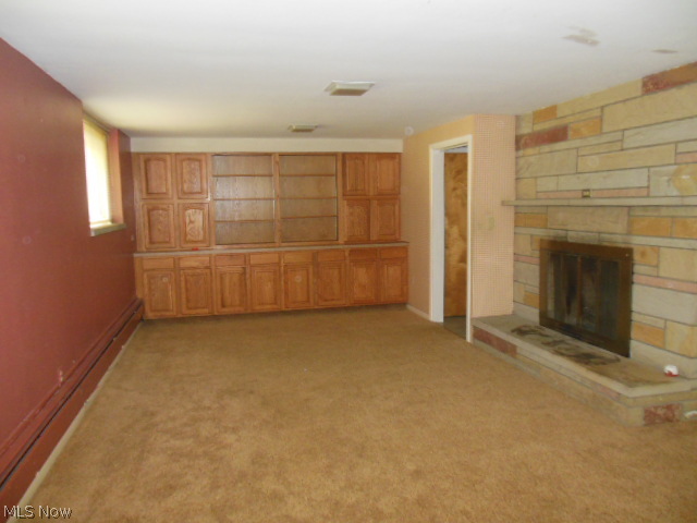 4468 Ammon Road Cleveland, OH 44143 - Photo 17 of 22 LOWER LVL REC RM W/BUILT IN CABINETS & SHELVES & FIREPLACE