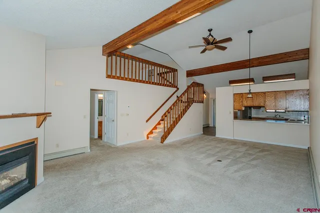 a kitchen with stainless steel appliances granite countertop a refrigerator and a stove