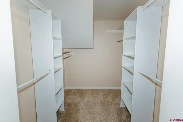 a view of a hallway with closet area