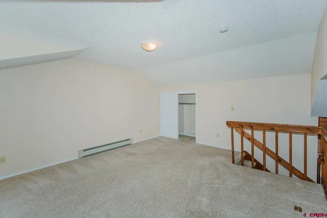 a bathroom with a shower and a sink
