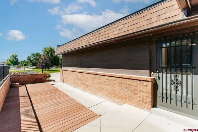 a balcony with view of wooden floor