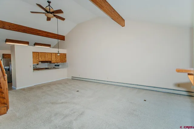 a view of empty room with a fireplace