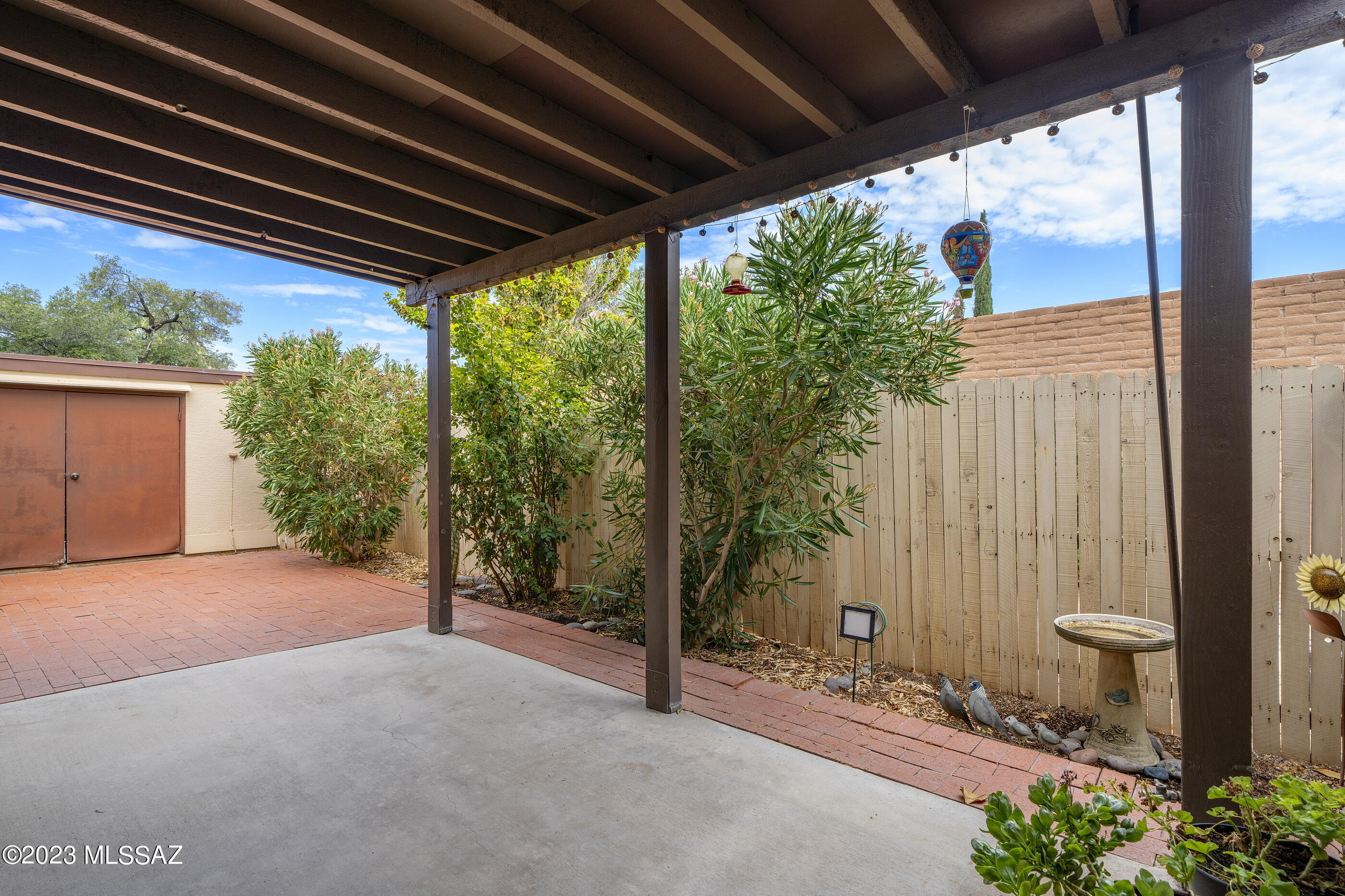 670 South Pantano Road, Unit E Tucson, AZ 85710 - Photo 16 of 17 a view of backyard with plants and outdoor seating