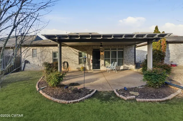 a view of an empty room with chandelier