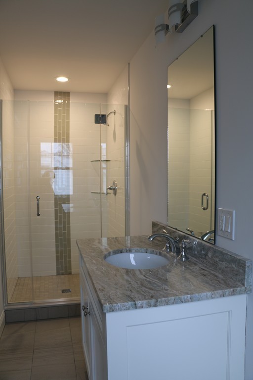 8 Patton Road Wellesley, MA 02482 - Photo 21 of 29 a bathroom with a granite countertop sink and a mirror