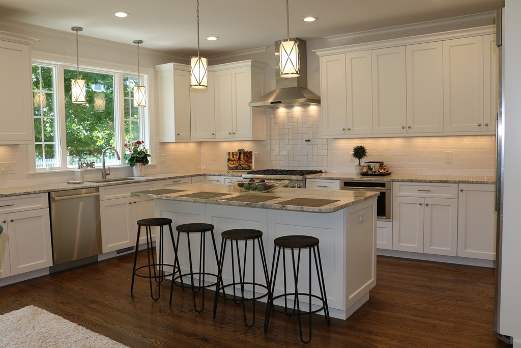 8 Patton Road Wellesley, MA 02482 - Photo 8 of 29 a kitchen with kitchen island granite countertop a sink cabinets and wooden floor