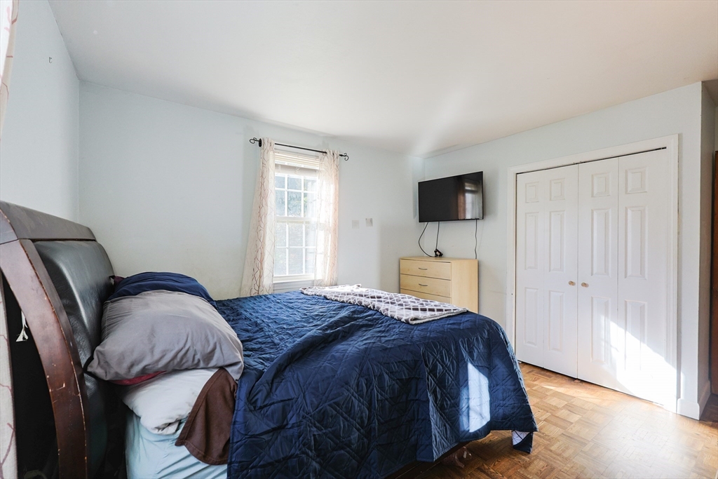12 Randall Street Acushnet, MA 02743 - Photo 13 of 20 a bedroom with a bed and a flat screen tv