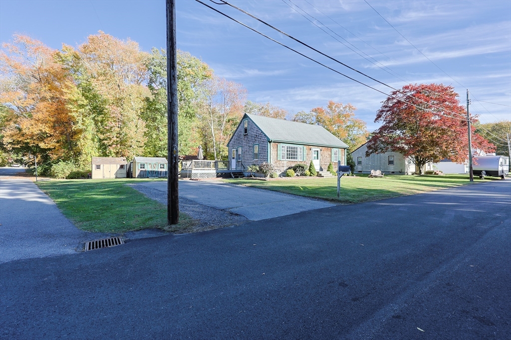12 Randall Street Acushnet, MA 02743 - Photo 3 of 20 a front view of a house with a yard and trees