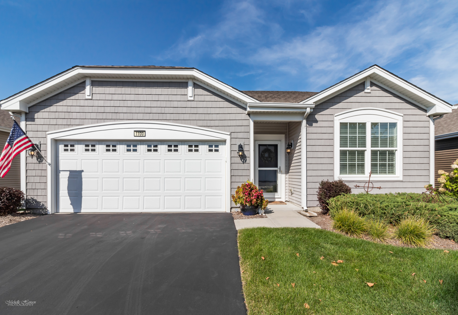 1100 Americana Avenue Pingree Grove, IL 60140 - Photo 1 of 20 a front view of a house with a yard and garage