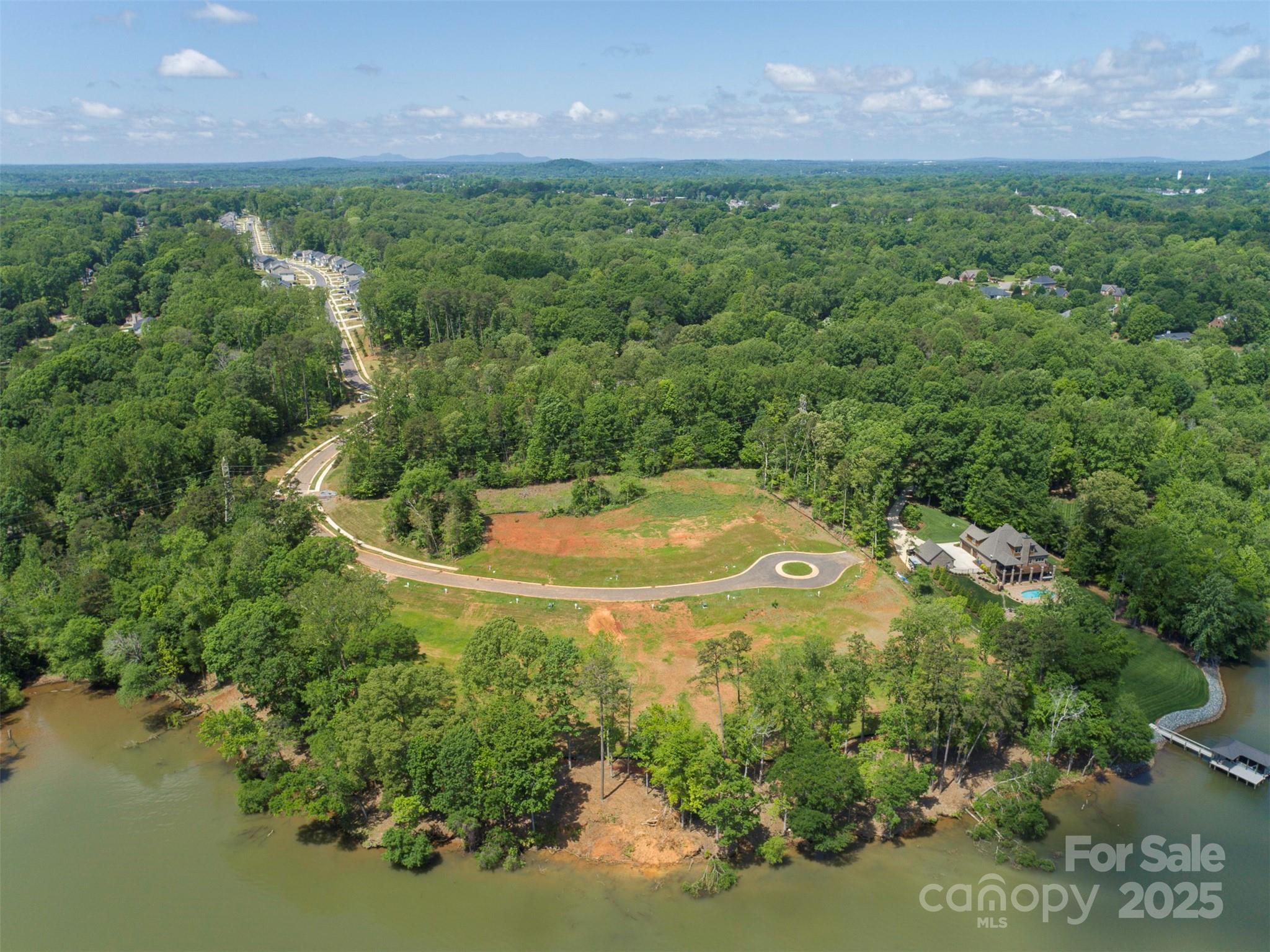 42 Watercourse Way, Unit DEVONSHIRE Belmont, NC 28012 - Photo 48 of 48 a view of a house with a outdoor space