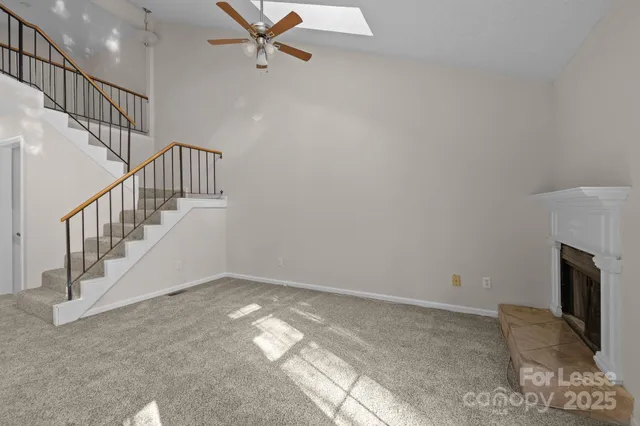 a view of a workspace with furniture and a potted plant