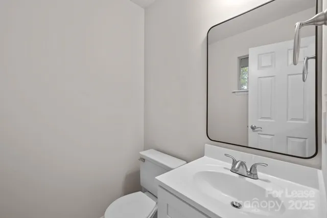 a bed room with a bed and a chandelier