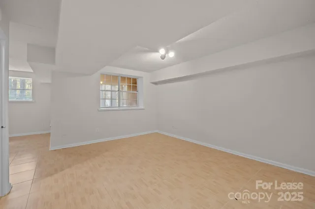 a view of a brick house with many windows