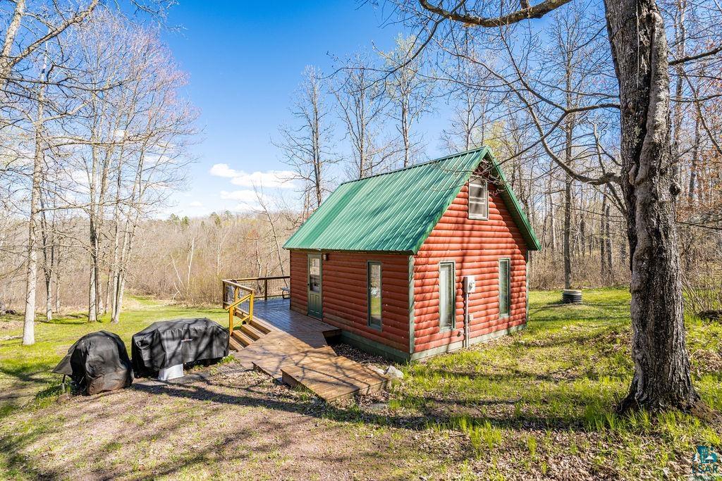 20663 Hardwood Loop Finlayson, MN 55735 - Photo 24 of 36 Rustic cabin featuring log-style siding and a vibrant green metal roof