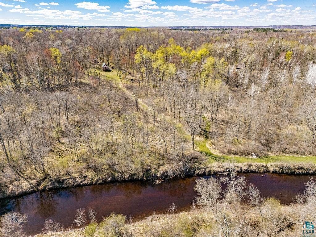 20663 Hardwood Loop Finlayson, MN 55735 - Photo 34 of 36 Wooded acreage featuring a winding river and a structure
