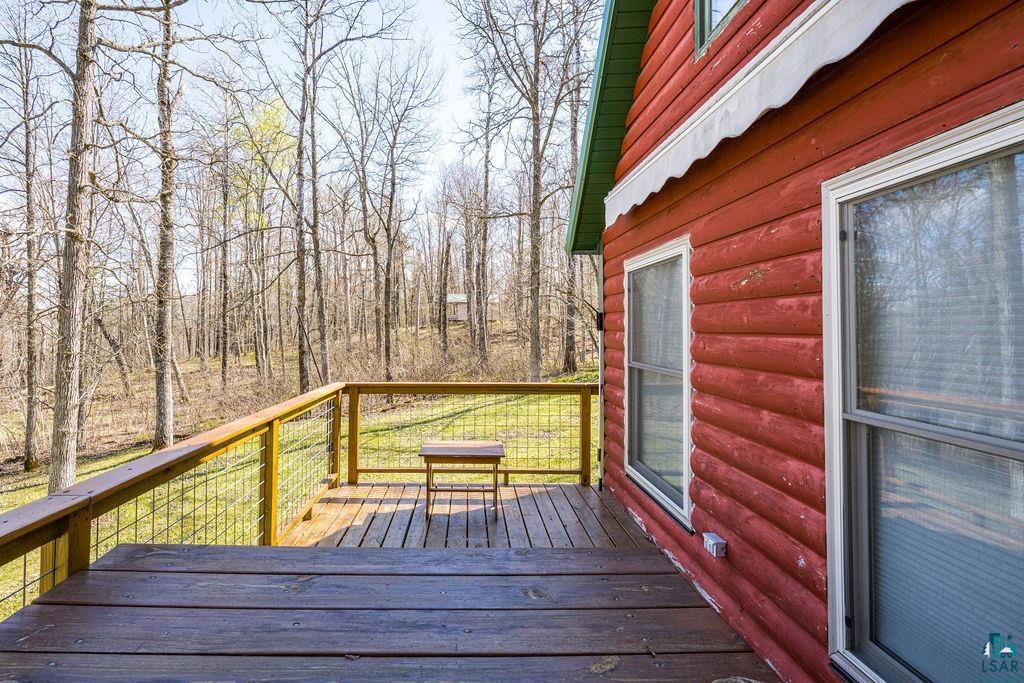 20663 Hardwood Loop Finlayson, MN 55735 - Photo 5 of 36 Expansive outdoor deck with wood flooring and metal-infill railing