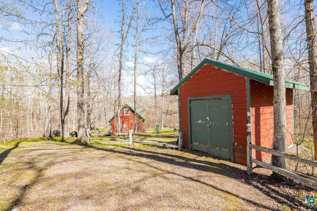 20663 Hardwood Loop Finlayson, MN 55735 - Photo 7 of 36 Red-sided outbuilding with green trim and a green roof
