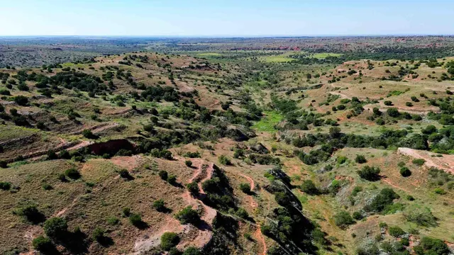 a view of a field with an outdoor space