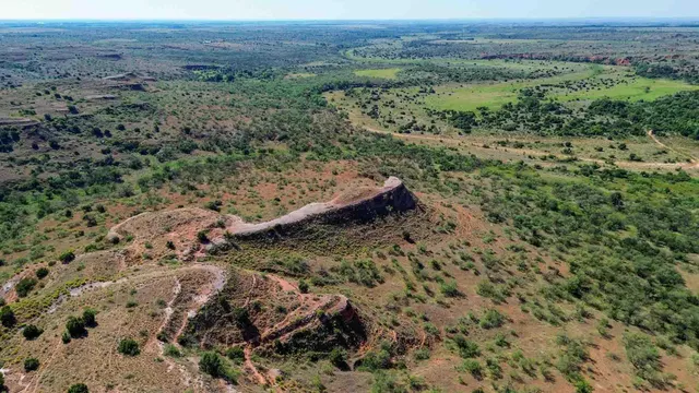 a view of a house with wooden fence