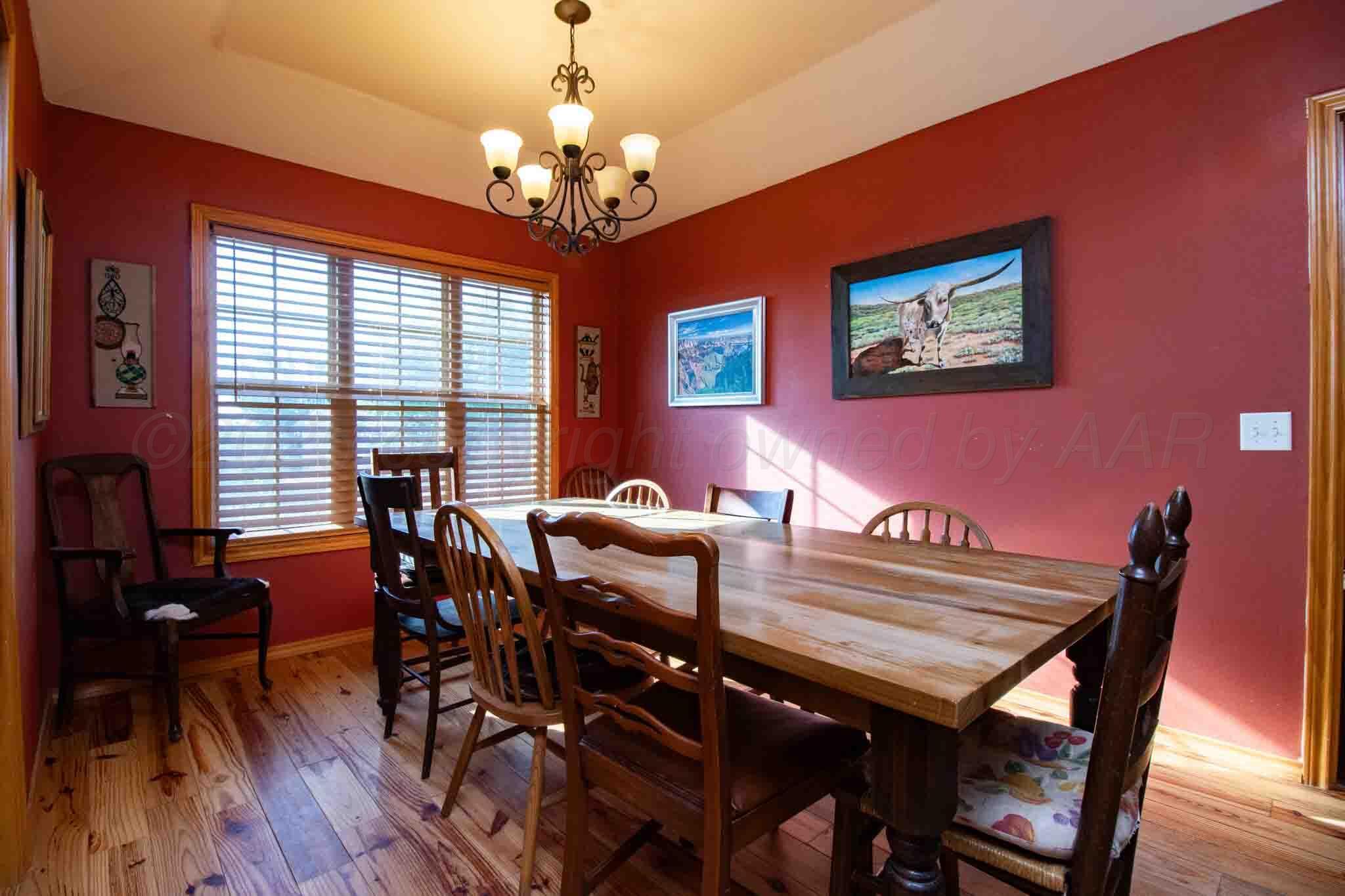 Reeves Ranch Memphis, TX 79245 - Photo 100 of 144 a view of a dining room with furniture window and wooden floor