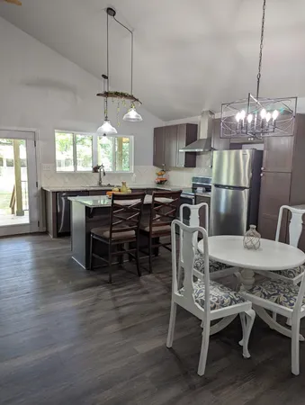 a bed sitting in a bedroom next to a window