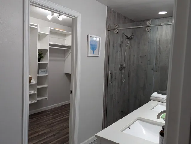 a bathroom with a sink a toilet and mirror